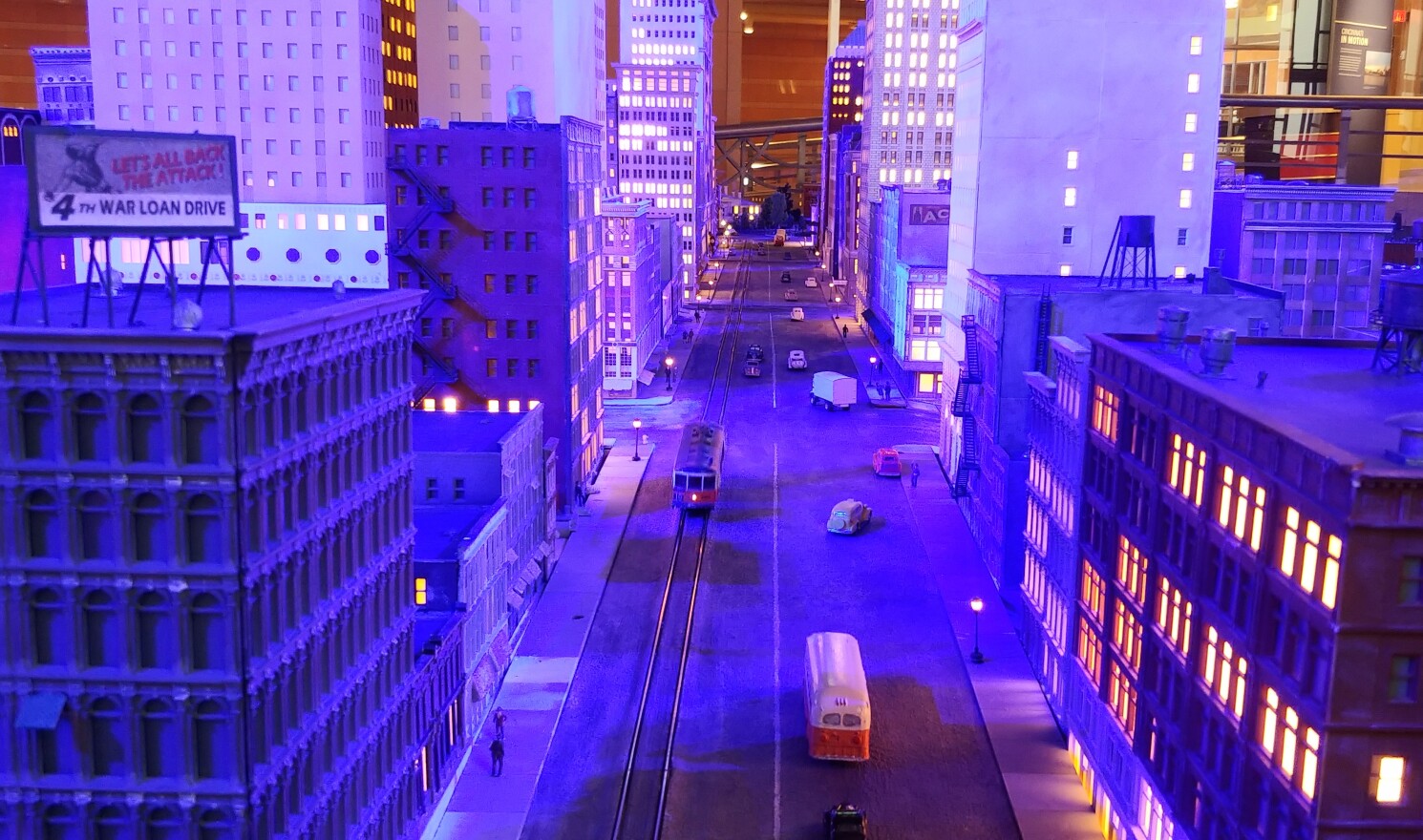 The night scene version of the diorama features blue flood lights and LEDs in model buildings.